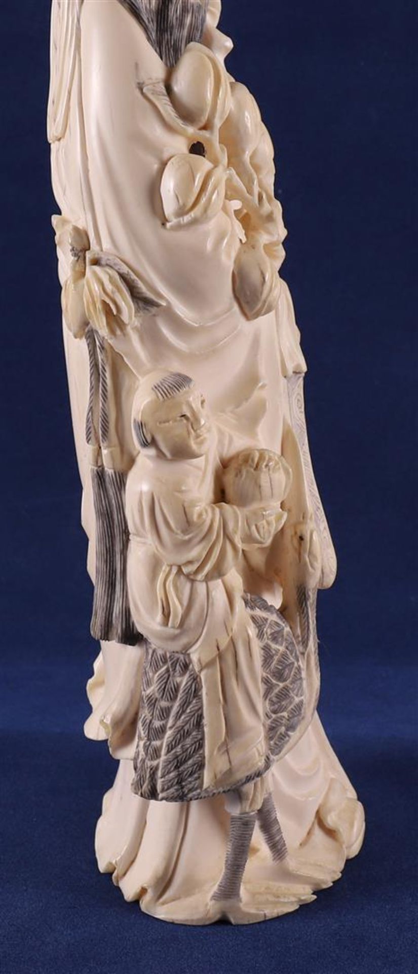 A carved ivory Shou Lao with staff and peaches in his hand, at his side a fool on a crane, China, - Image 12 of 14