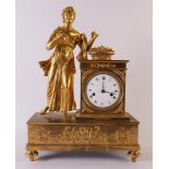 A fire-gilt Empire mantel clock, France ca. 1820. Crowning of an elegant lady with a fruit basket,