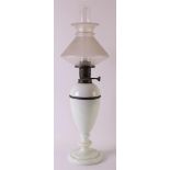 A white opaline glass standing table lamp, late 19th century, h 68 cm.