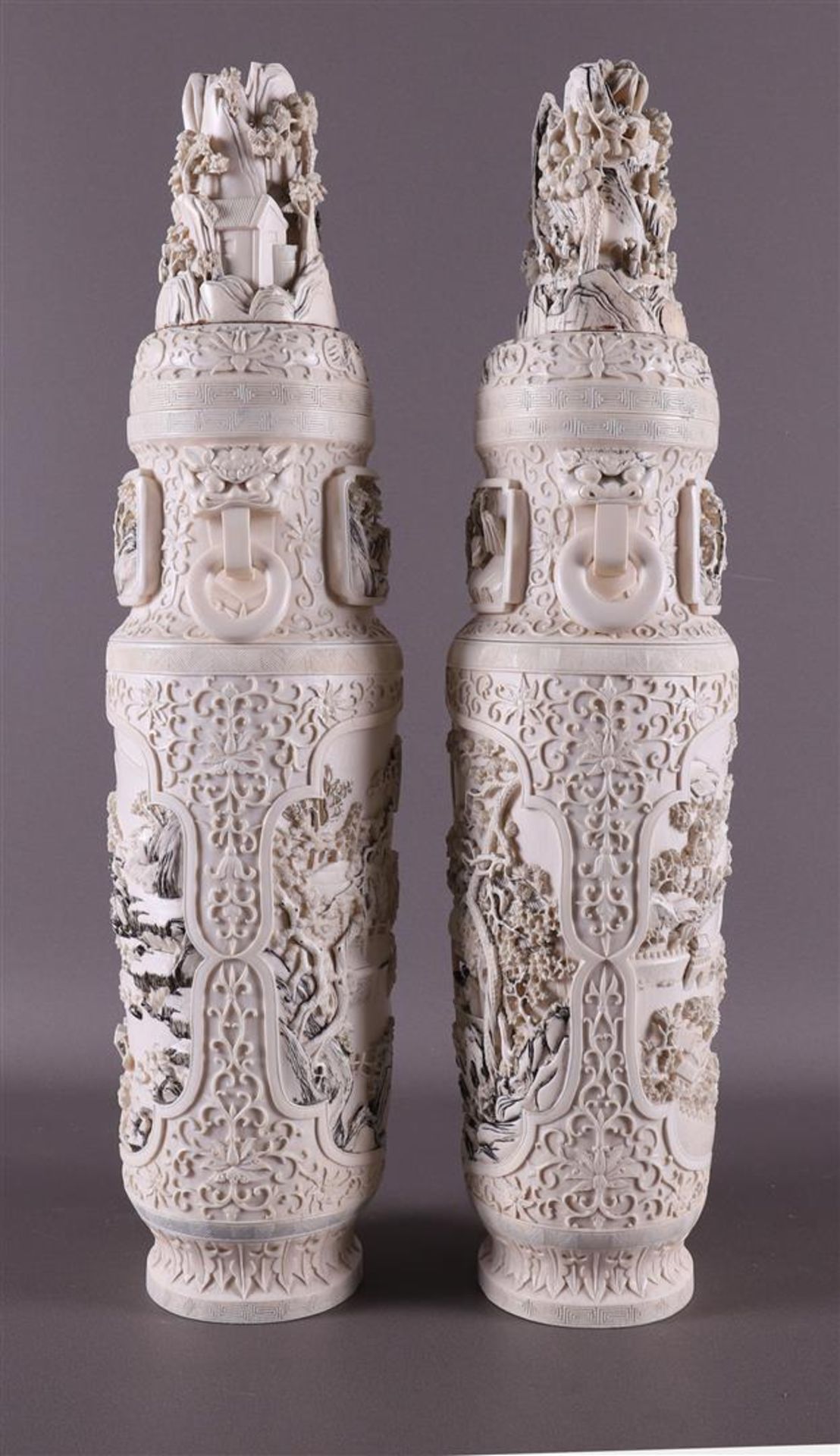 A pair of carved ivory baluster-shaped lidded vases with ringed lion heads as ears, China, Qing - Image 16 of 28