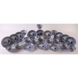 Twelve blue/white porcelain cups and saucers, China, late 19th century. Blue underglaze floral