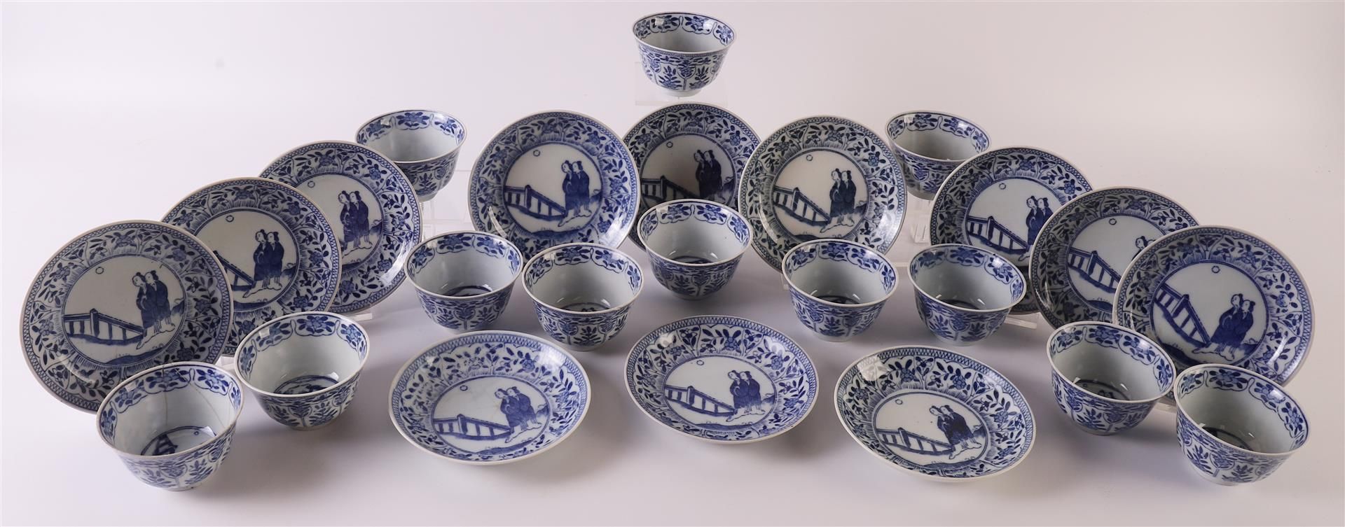 Twelve blue/white porcelain cups and saucers, China, late 19th century. Blue underglaze floral