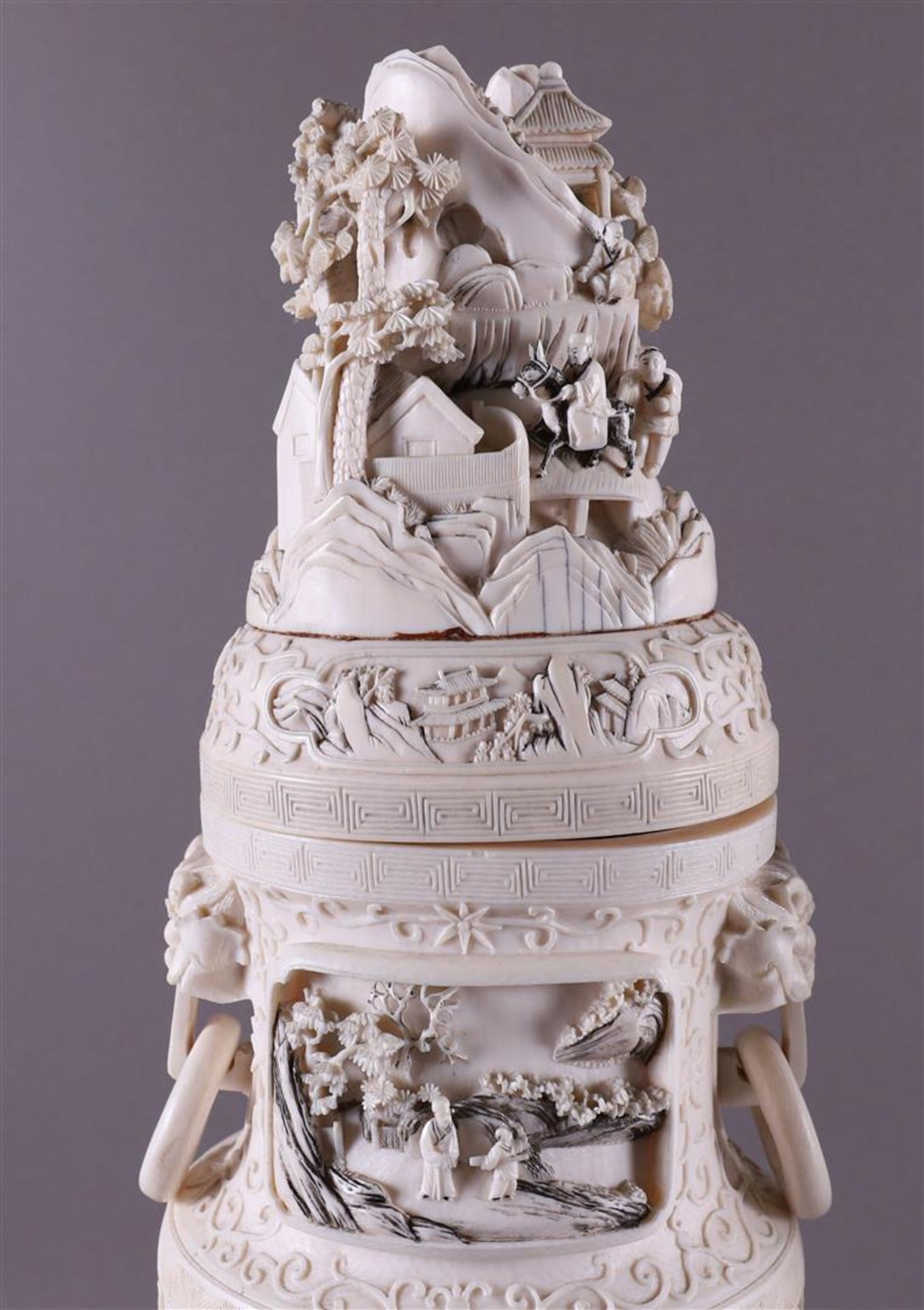 A pair of carved ivory baluster-shaped lidded vases with ringed lion heads as ears, China, Qing - Image 3 of 28