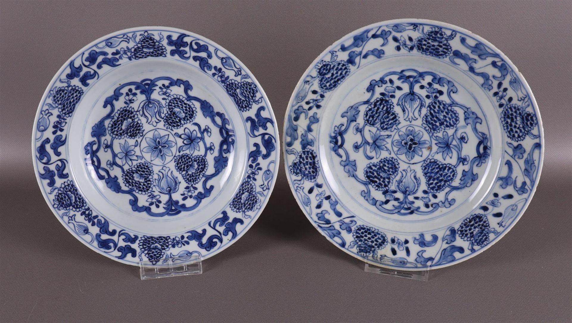 Two various blue/white porcelain plates, China, 18th century. Blue underglaze floral decoration on
