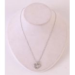 An 18 kt 750/1000 gold anchor necklace, 45 cm and a heart-shaped pendant with 15 diamonds, marked