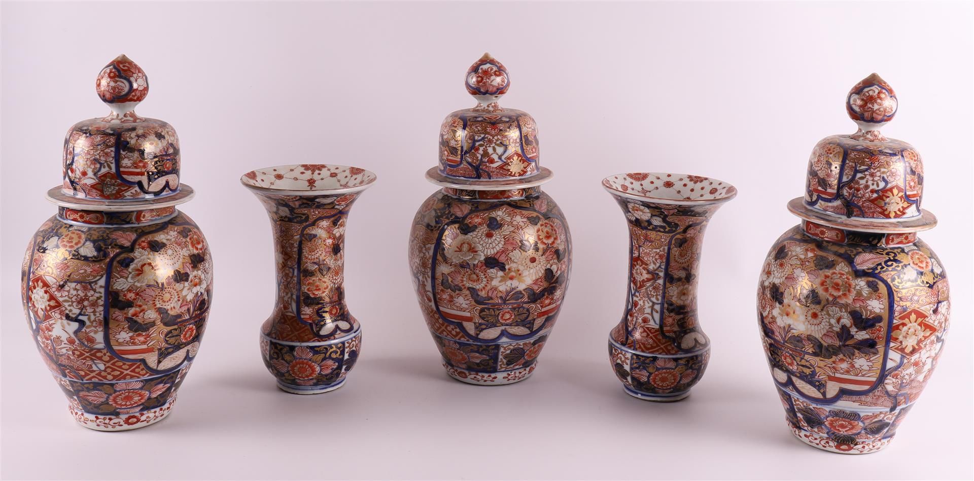 A five-piece porcelain Imari cabinet set, consisting of: three lidded vases and two vases with