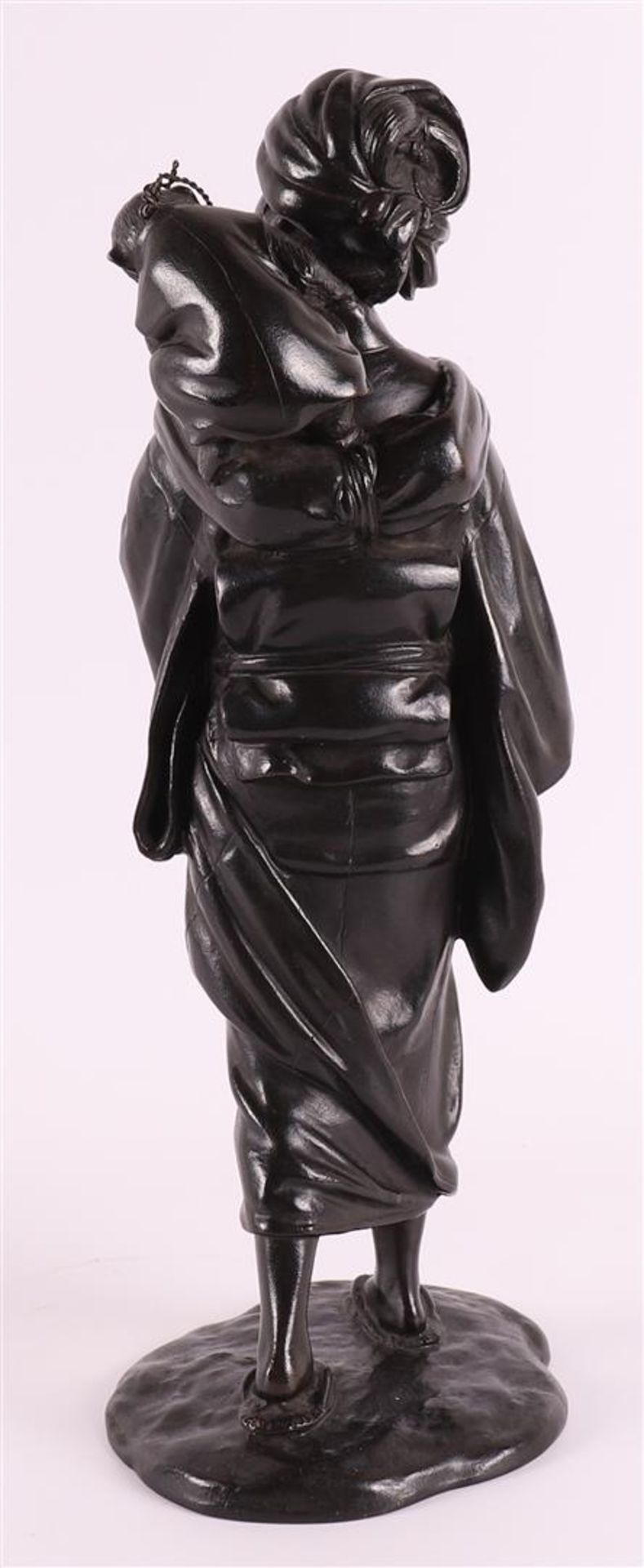 A dark patinated bronze okimono of a woman with a monkey on her shoulder, Japan, 1st half of the - Image 3 of 4