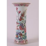 A trumpet-shaped porcelain famille rose vase, China, 18th century. Polychrome decor of birds and