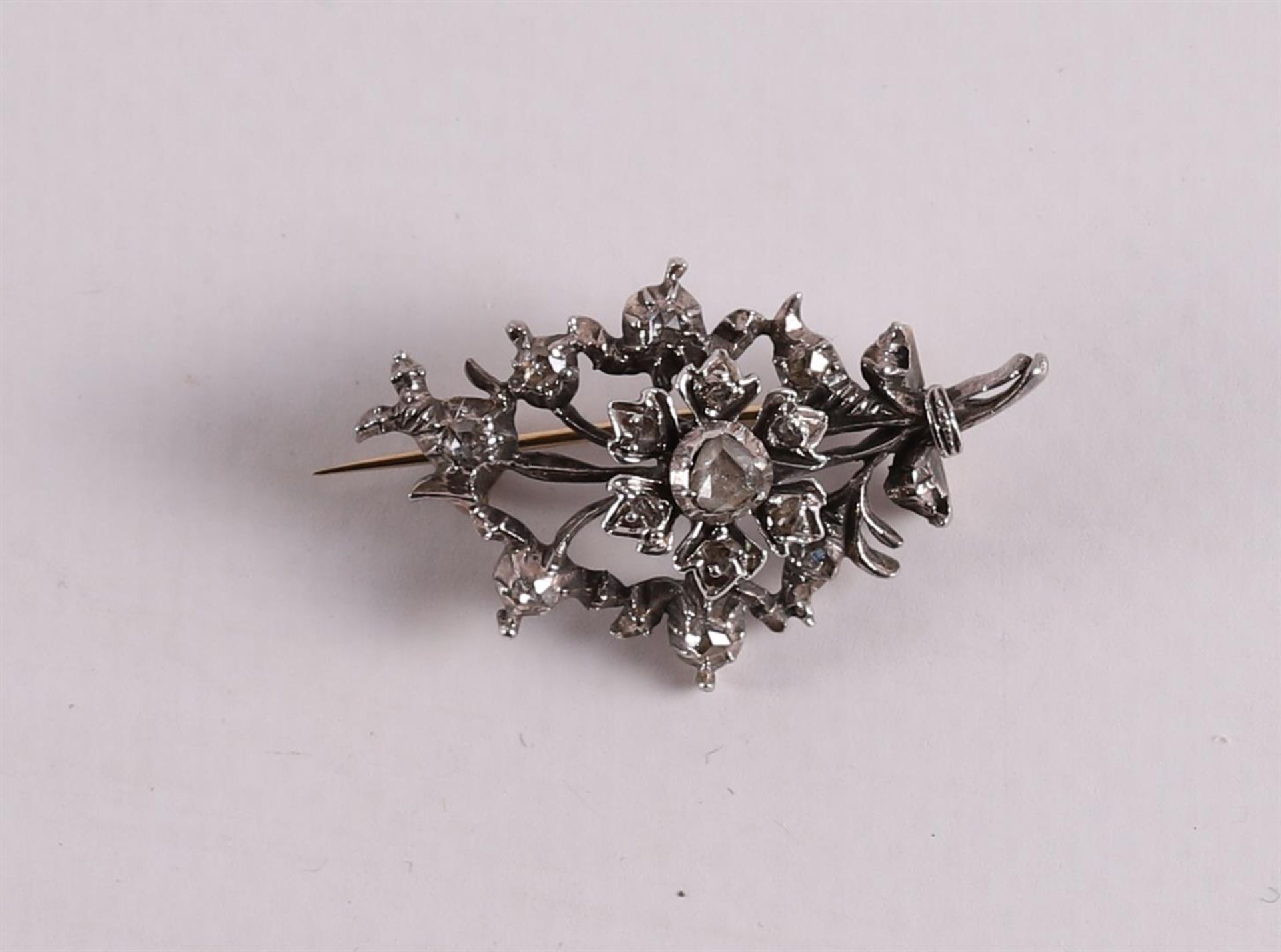 A gold on silver branch brooch, set with rose cut diamonds, 19th century, gross weight 5.5 grams,