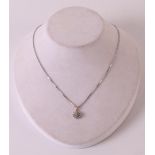 A 14 kt 585/1000 white gold necklace on ditto pendant, set with 21 diamonds, gross weight 5.3