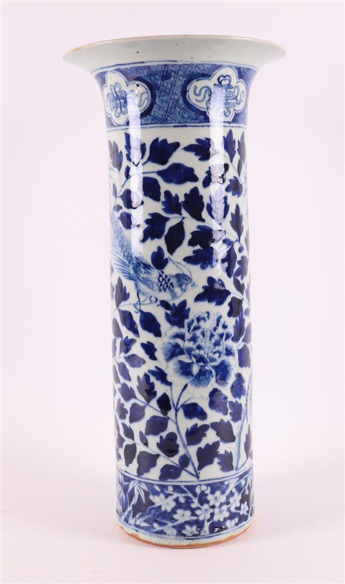 A cylindrical blue and white porcelain trumpet vase, China, 19th century. Blue underglaze floral