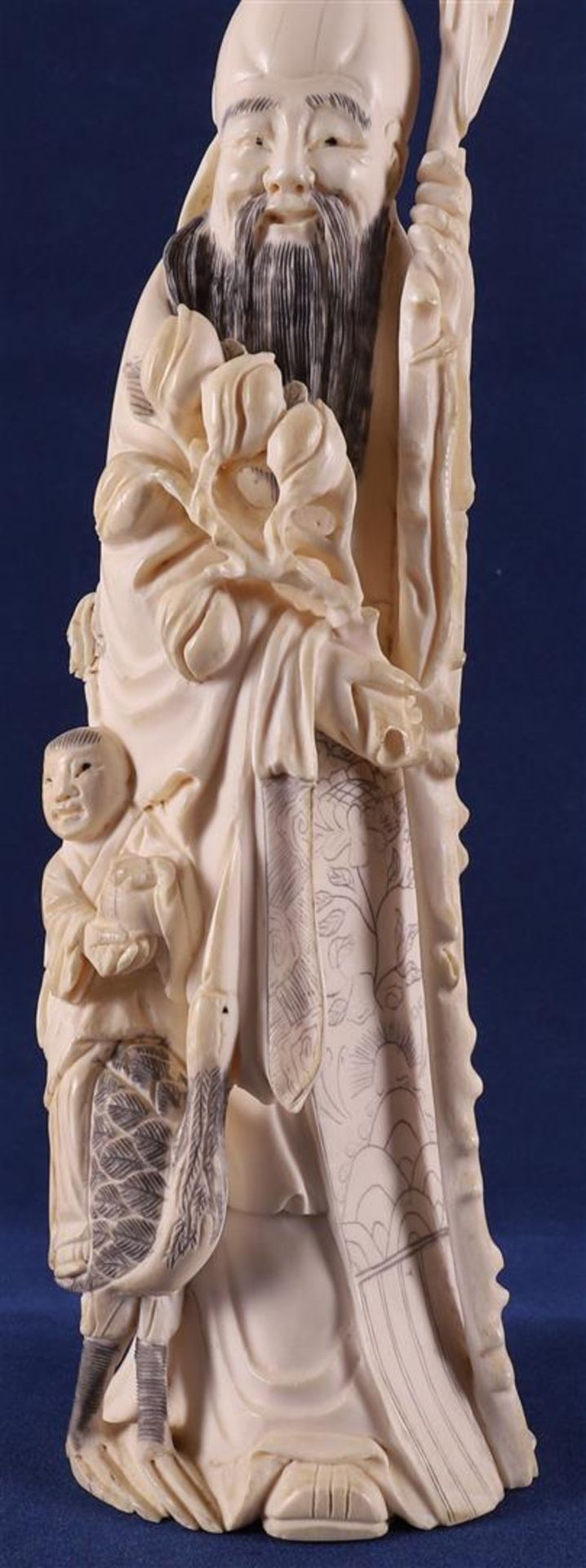 A carved ivory Shou Lao with staff and peaches in his hand, at his side a fool on a crane, China, - Image 3 of 14