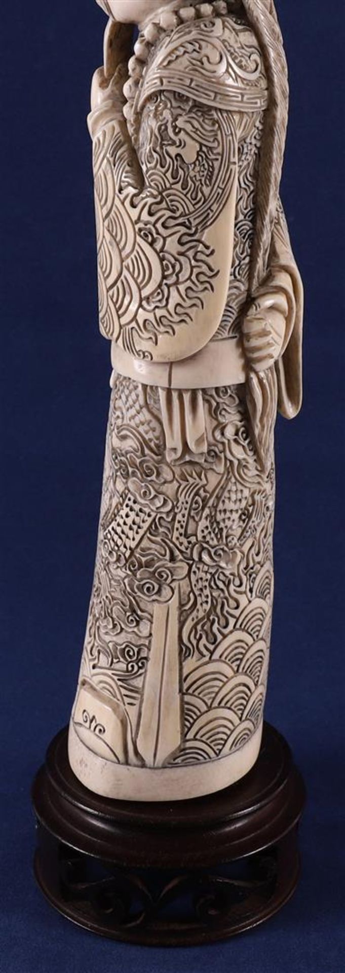 A carved ivory figure of a Mandarin, China, late 19th century. Signed 'Qianlong' bottom, h30 cm, - Image 6 of 14