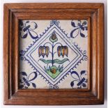 A polychrome earthenware tile depicting a pomegranate, Holland, 17th/18th century. In wooden