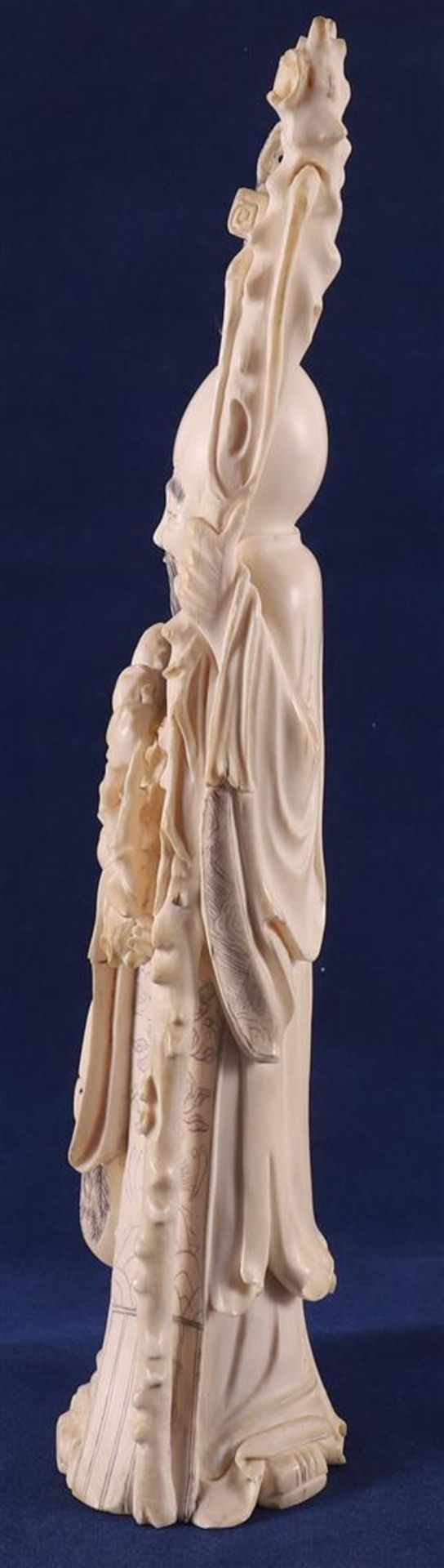 A carved ivory Shou Lao with staff and peaches in his hand, at his side a fool on a crane, China, - Image 4 of 14