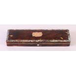 A rectangular tortoiseshell glasses case, with mother-of-pearl rim and gold application on the