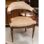 An oak semi-circular office chair with beige fabric upholstery, 19th century. Armrests ending with