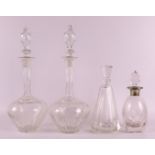 A pair of cut crystal baluster-shaped decanters with long necks, circa 1900. Faceted decoration.