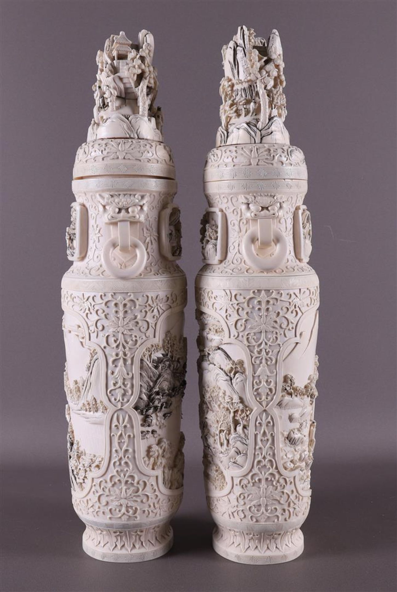 A pair of carved ivory baluster-shaped lidded vases with ringed lion heads as ears, China, Qing - Image 6 of 28