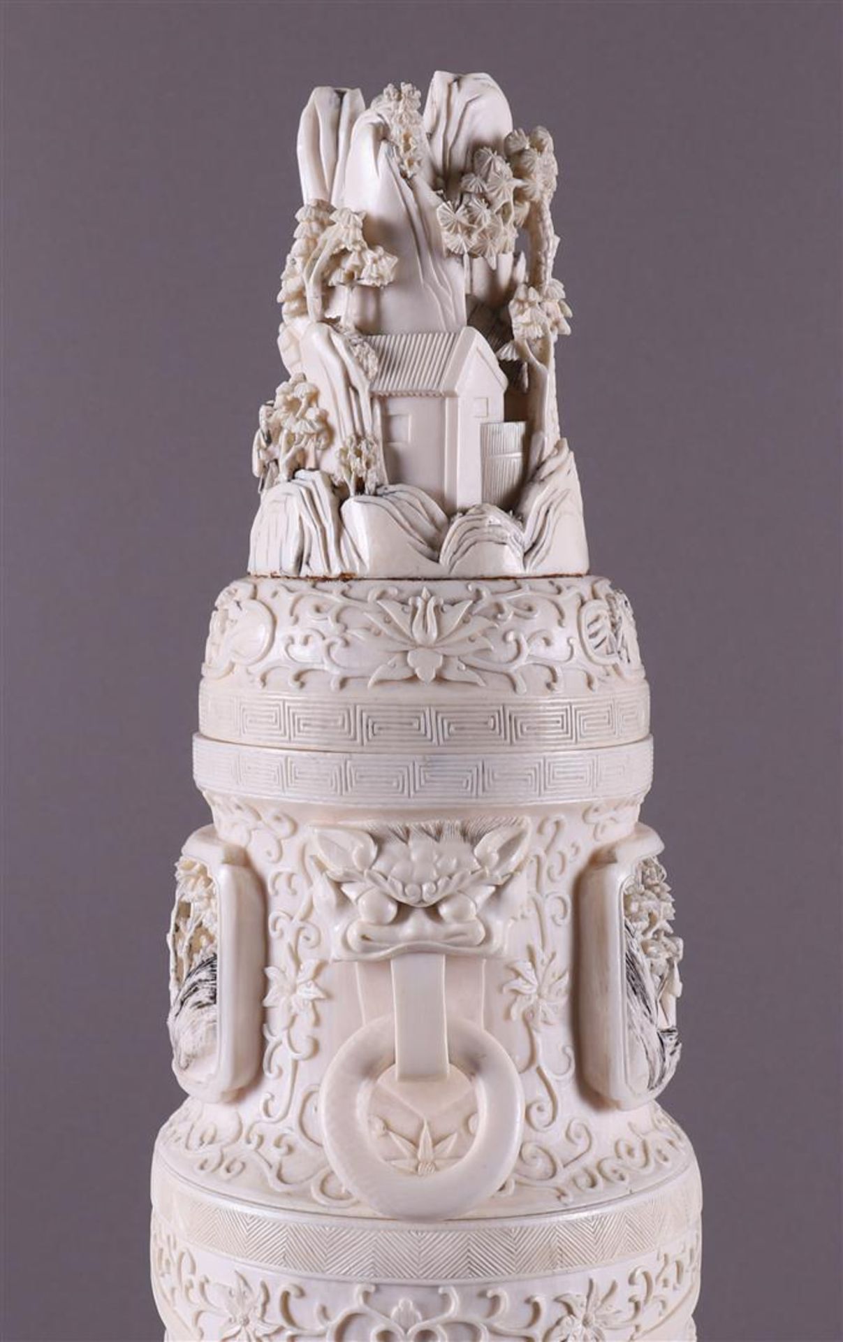 A pair of carved ivory baluster-shaped lidded vases with ringed lion heads as ears, China, Qing - Image 18 of 28