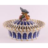 An oval porcelain lidded basket with openwork edge, France, Sèvres, 20th century. Polychrome