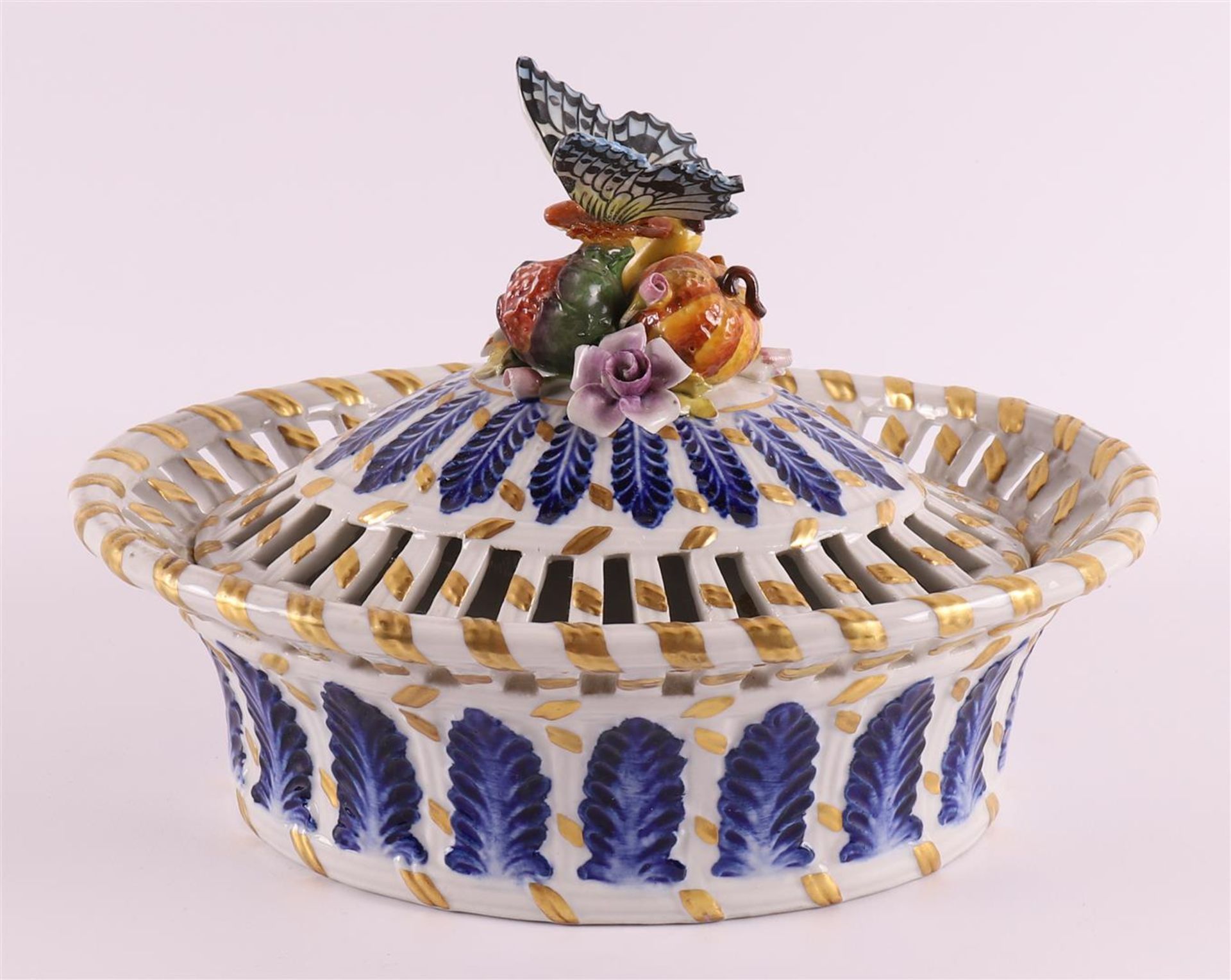 An oval porcelain lidded basket with openwork edge, France, Sèvres, 20th century. Polychrome
