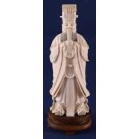 A carved ivory dignitary Lu Dongbin, on wooden base, China, late 19th century, 19 cm, 400 grams. (