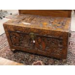 A so-called tropical wooden camphor box with carved Chinoise landscape decor, 1st half of the 20th