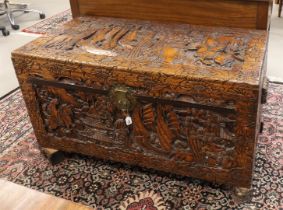 A so-called tropical wooden camphor box with carved Chinoise landscape decor, 1st half of the 20th