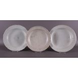 Three various white glazed contoured dishes, China, Song/Ming, Ø 18-19 cm, tot. 3x.