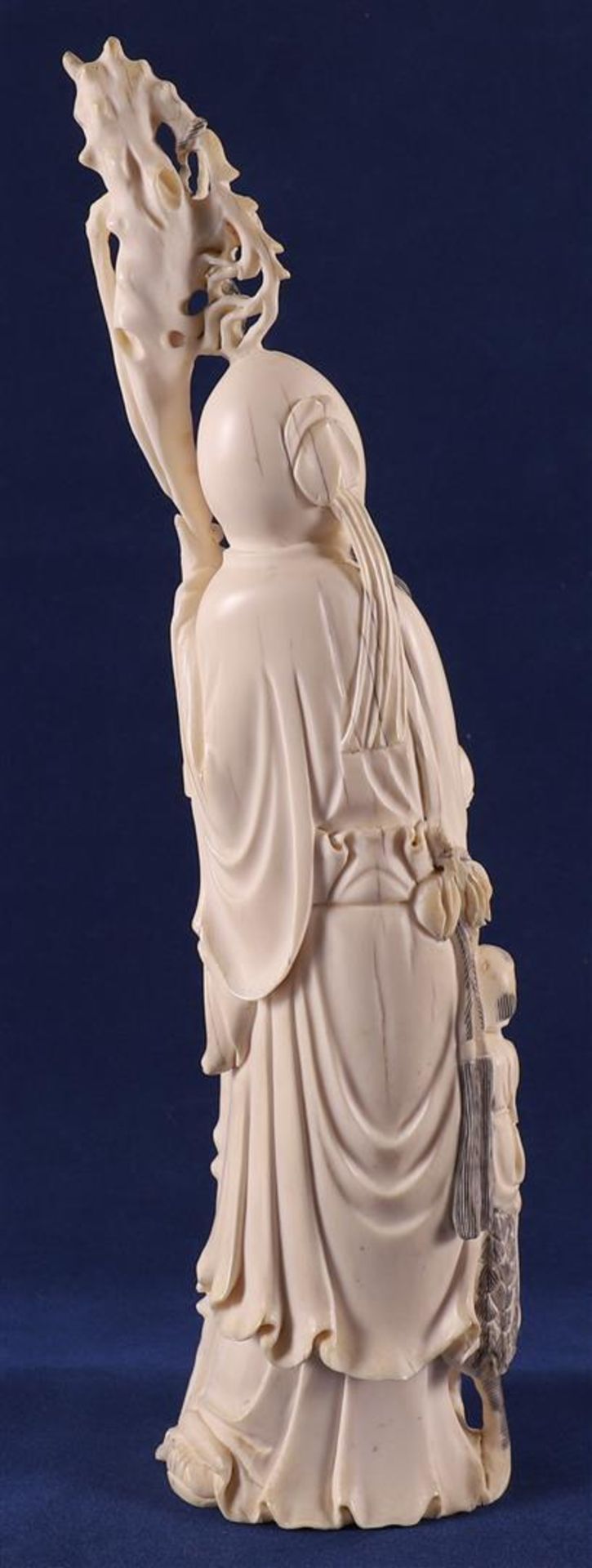 A carved ivory Shou Lao with staff and peaches in his hand, at his side a fool on a crane, China, - Image 7 of 14