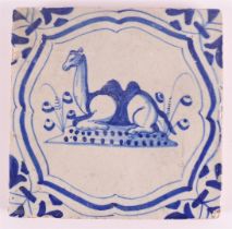 A blue/white tile with a dromedary decor in a cartouche, Holland, 17th century, h 13 x w 13 cm.