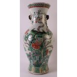 A baluster-shaped porcelain famille verte vase, China, 19th century. Polychrome decor of birds on