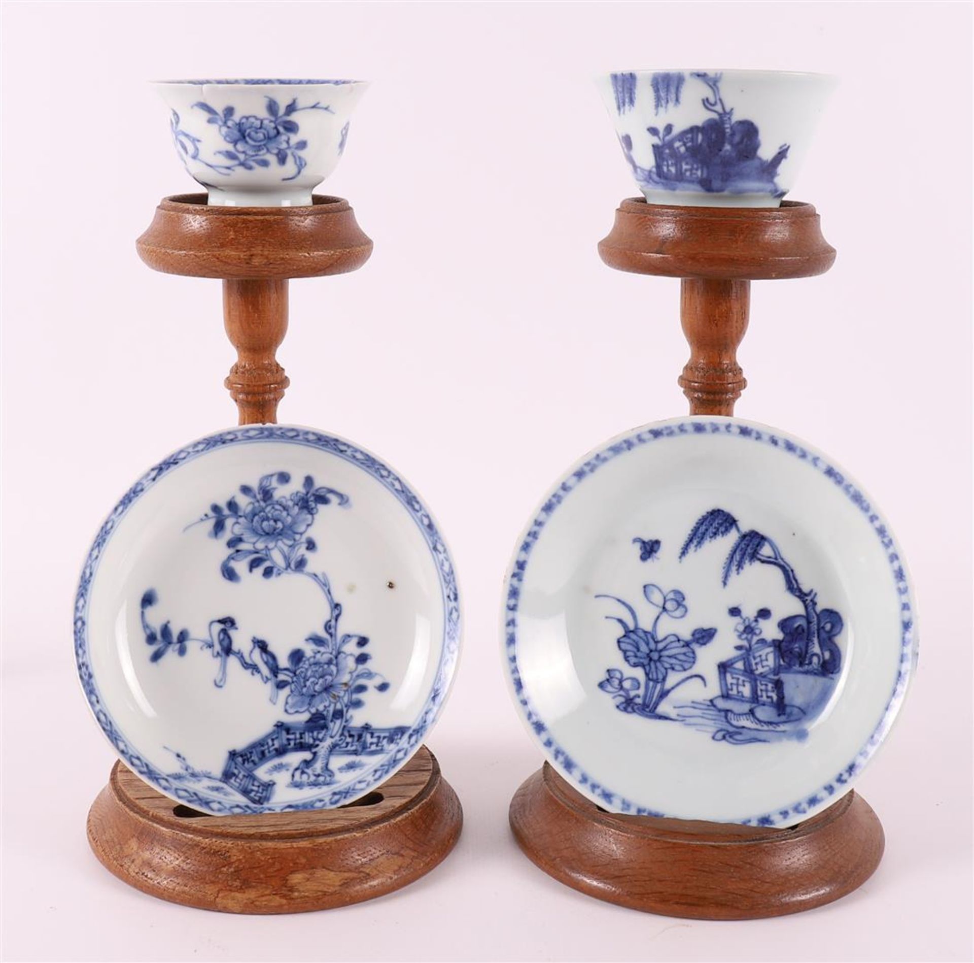 Two blue/white porcelain cups and saucers, China, Qianlong, 18th century. Blue underglaze decor of