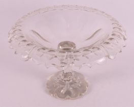 A clear crystal bowl with folded edge, ca. 1880. Decoration of olive cut, two buttons in the stem,