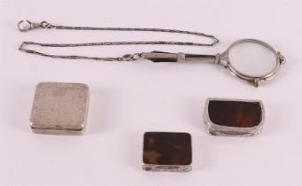 Three various silver pill boxes, including one set with a tortoise, 1st half of the 20th century.