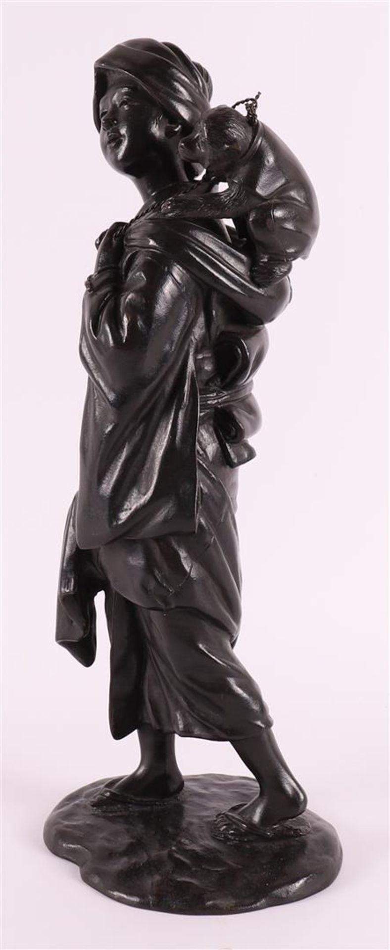 A dark patinated bronze okimono of a woman with a monkey on her shoulder, Japan, 1st half of the - Image 2 of 4