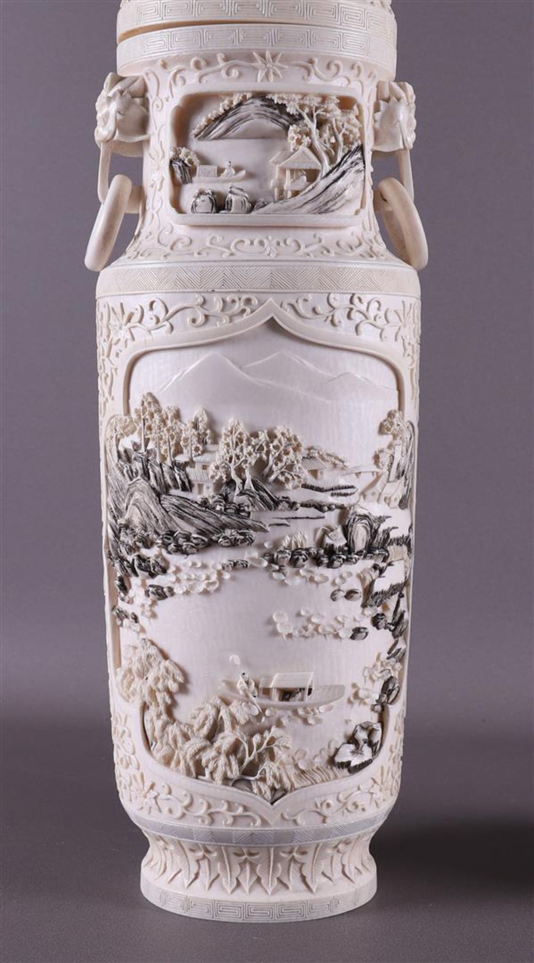 A pair of carved ivory baluster-shaped lidded vases with ringed lion heads as ears, China, Qing - Image 12 of 28