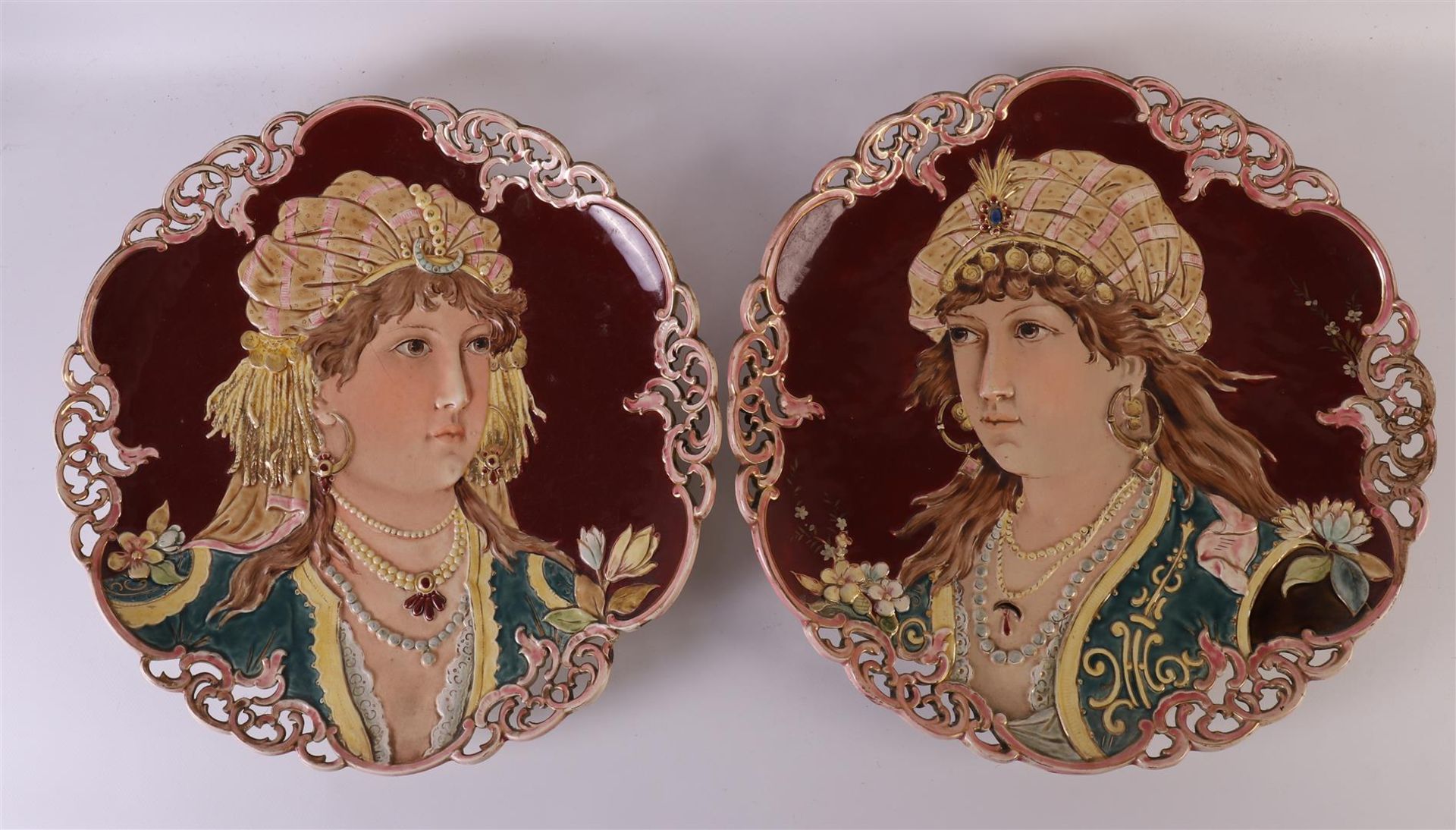 A pair of Art Nouveau earthenware dishes with partly ajourned edge, Bohemia, around 1900. Polychrome