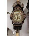 A chair clock, Friesland 20th century. Polychrome decorated wooden chair with cut-out mermaids as