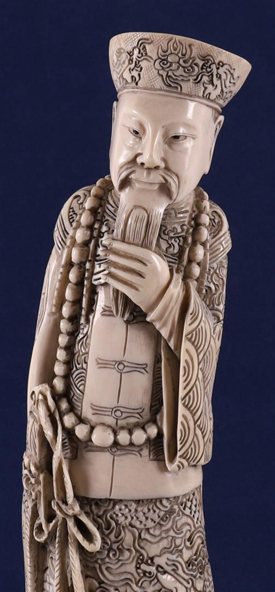 A carved ivory figure of a Mandarin, China, late 19th century. Signed 'Qianlong' bottom, h30 cm, - Image 2 of 14