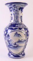 A baluster-shaped Jen-Jen vase, Indo China, 20th century. Blue underglaze landscape decor in