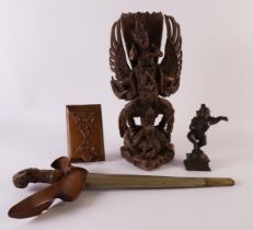 A lot of various Indonesian wood carvings, including Garuda, kris, 1st half of the 20th century.