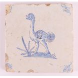 A blue/white tile with a decor of an ostrich with an ox's head, Holland, 17th century, h 13 x w 13