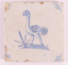 A blue/white tile with a decor of an ostrich with an ox's head, Holland, 17th century, h 13 x w 13