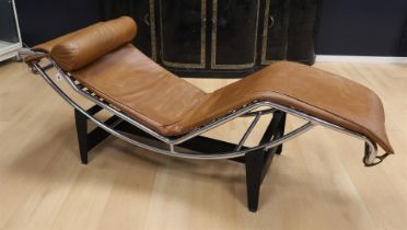 A chrome-plated tubular frame lounge chair, in the style of Le Corbusier. Brown leather upholstery.