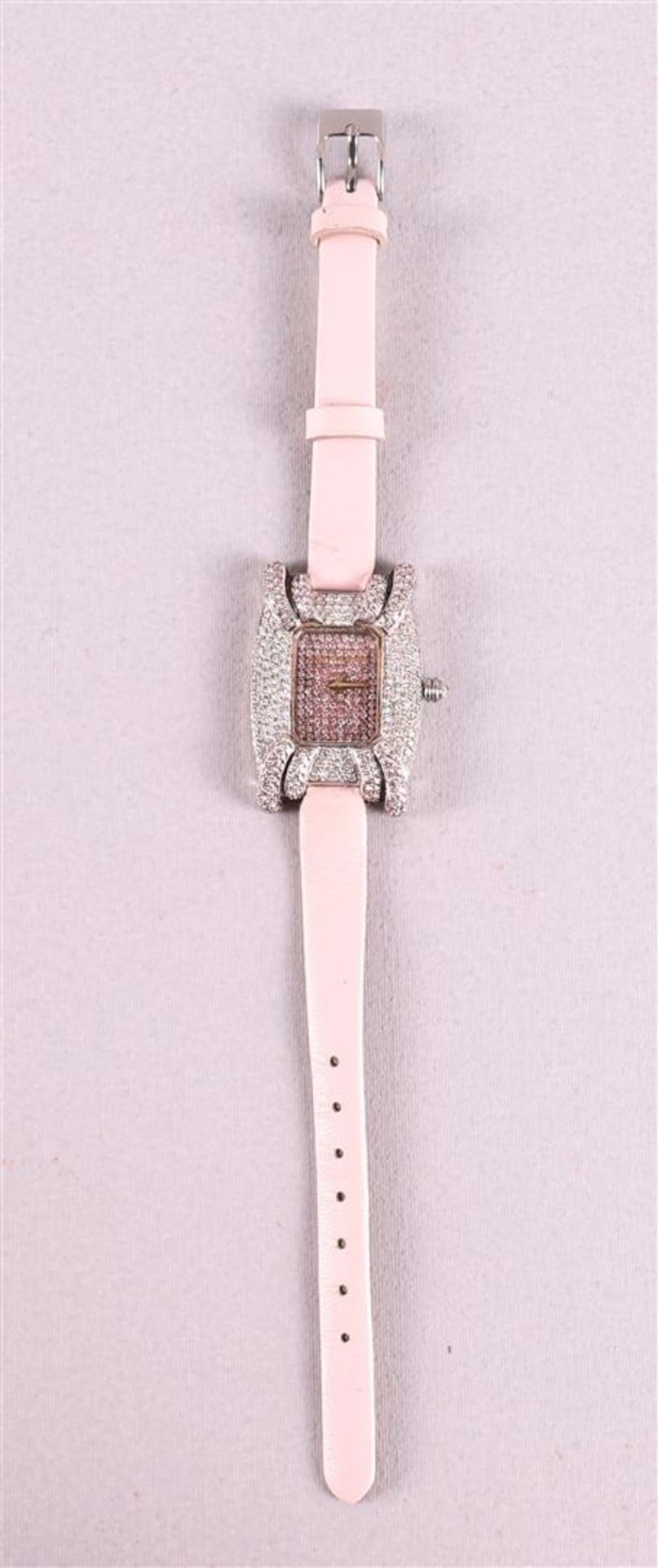 A Treasury women's wristwatch with an entourage of many brilliants, on a pink leather strap. The