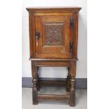 A one-door cupboard, Holland, 18th century and later (composite). Oak wood, straight hood, door with