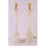 A pair of columnar alabaster lamp bases, 20th century, h 52 cm, to. 2x.
