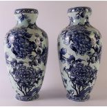 A pair of blue/white porcelain baluster-shaped vases, late 19th century. Blue underglaze decor of
